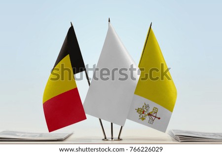 Flags of Belgium and Vatican City with a white flag in the middle