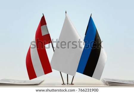 Flags of Austria and Estonia with a white flag in the middle