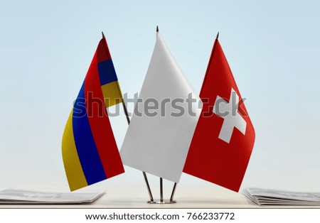 Flags of Armenia and Switzerland with a white flag in the middle