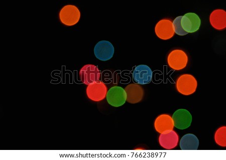 Defocused bokeh lights, Abstract blurred glittering shine. Blur light bokeh, night background. Christmas wallpaper decorations concept. New year holiday  backdrop. Sparkle circle celebrations display.