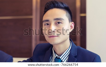 Young Asian men are at dinner, portrait shooting