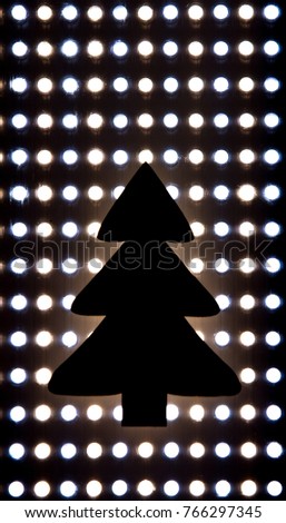 Christmas tree silhouette with lights background. Lay flat