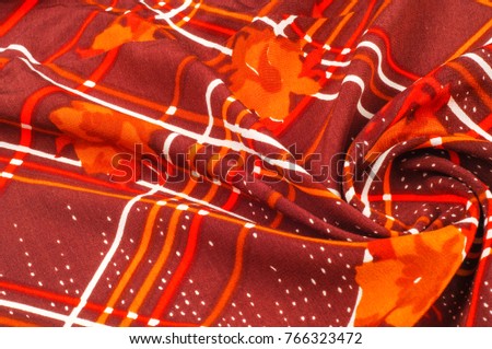 Texture, pattern, background. Fabric silk. Dark burgundy color. Painted squares with white lines, yellow flowers. This is a light Burgundian silk duo. This double shaded pure silk duo