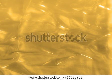 fabric, background texture Silk yellow gold. Gold and luxe are in the same, especially when it comes  A gold foil covers this velvet creating a detailed damask pattern that portrays nothing but luxury