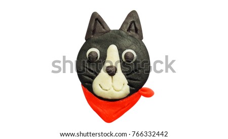 Plasticine black cat and red scarf isolated on a white background. Clipping path.