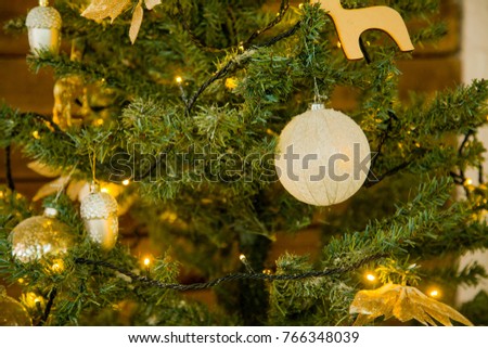 Christmas decoration on a Christmas tree. New Year's toys. Good New Year spirit. garland on the tree