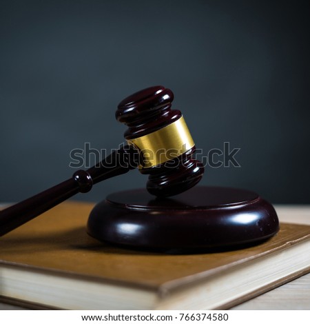  Golden scales of justice, gavel and books on brown background, Law code