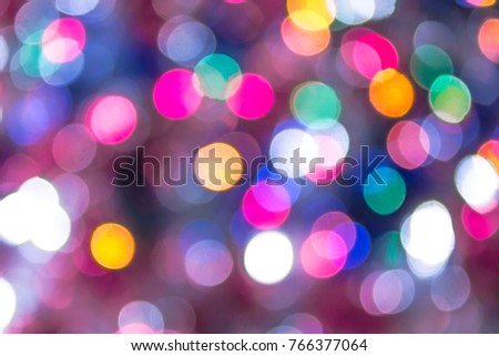 Multicolored abstract bokeh lights as background for design