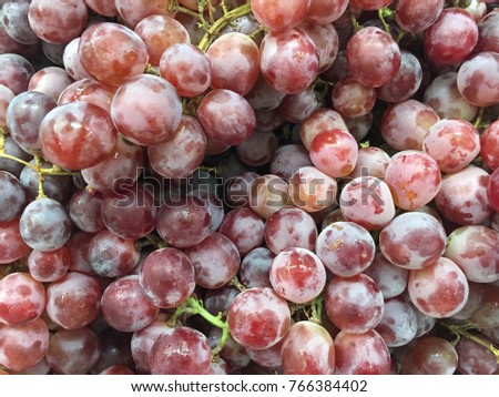 Red wine grapes background pattern , ripe grapes
