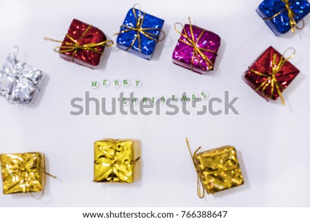 Merry Christmas decorations. Small presents on white backgrounds.