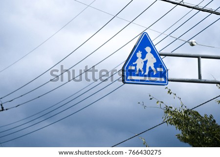 A blue sky and a blue sign