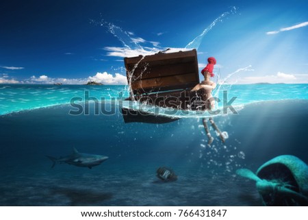 Shipwrecked in danger of being devoured by a shark