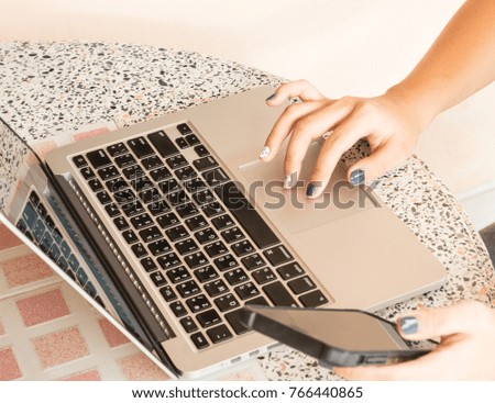 hands of young girl working on laptop computer
