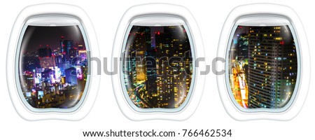 Three porthole frame windows aerial view over Tokyo cityscape and Shiodome skyscrapers and business offices view from Tokyo World Trade Center at night, Tokyo, Japan.