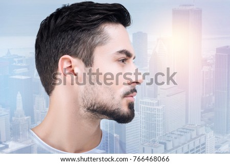 Perfect profile. Serious man turning head and looking forward while thinking about work