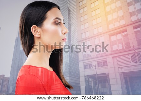 Angry with you. Proud young woman having brunette hair and looking forward while demonstrating her profile