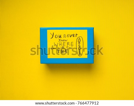 Blue box with concept card on yellow background. You never know where you will find the answer.