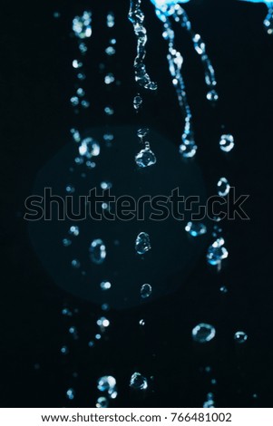 Water splash isolated on black background. A splash