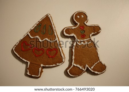 This is a ginger bread with a shape of girl and Christmas tree. They are so cute and nice for Christmas time. 