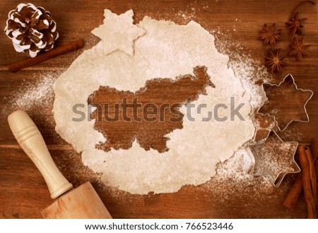 Festive cookie dough with the shape of Slovenia cut out (series)