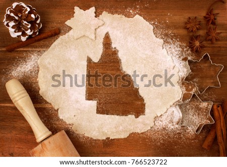 Festive cookie dough with the shape of Queensland cut out (series)