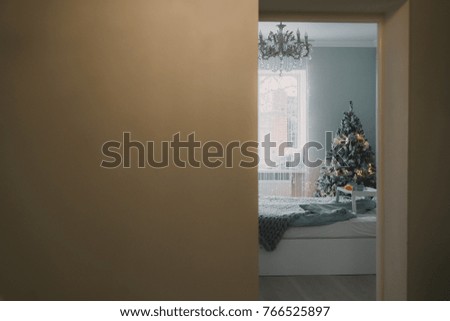Interior of a bedroom on a Christmas morning. New Year's morning. Elements of the decor of the christmas decoration of the bedroom