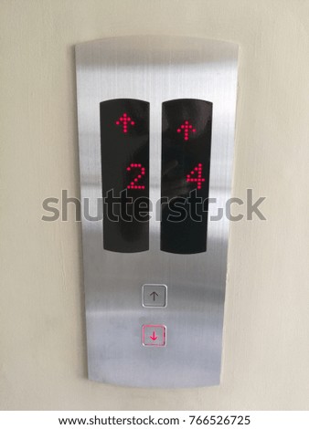 Push-button lifts are both up and down on the stainless steel panel.