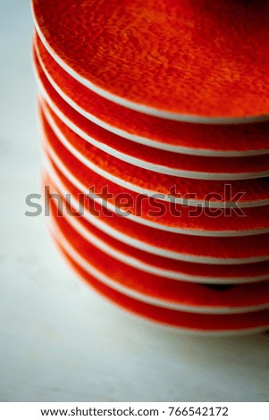 The color of the sun. Warmth. Bright orange dishes in the style of a Mandarin or orange. Ceramics