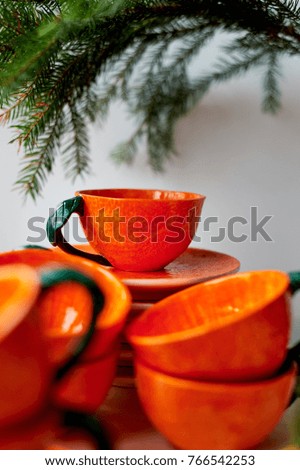 The color of the sun.Warmth. Bright orange dishes in the style of a Mandarin or orange. Ceramics