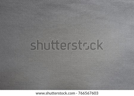 Dense grey cotton fabric surface from above