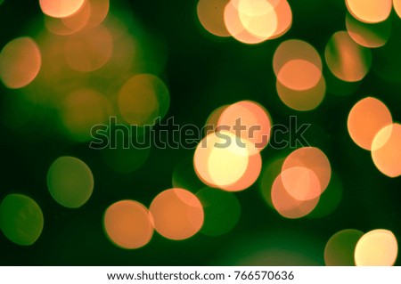 Green and red Bokeh background. Concept Christmas Day.
