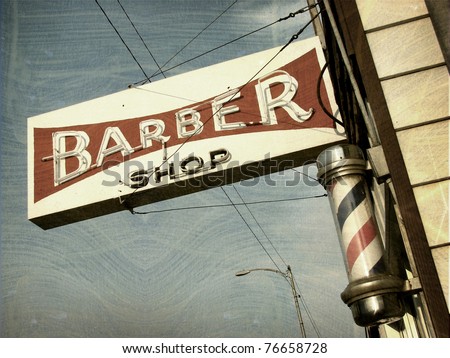aged and worn vintage photo of barber shop sign