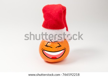 Christmas background with tangerine in Santa Claus hat. Funny character.