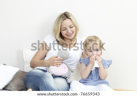 mother with a sniffing daughter Royalty-Free Stock Photo #76659343