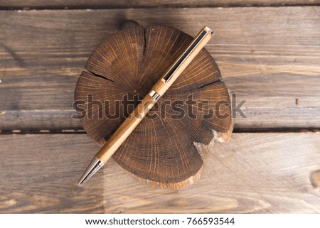 wooden writing pens on grey wooden table