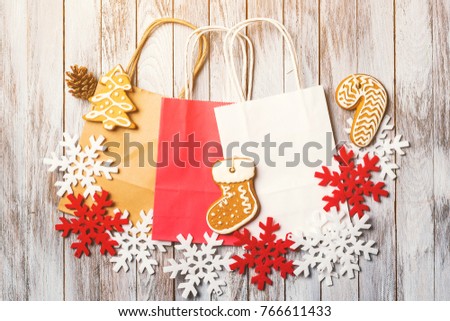 Christmas background with colorful paper bags . Flat lay. Christmas sale and shopping concept.