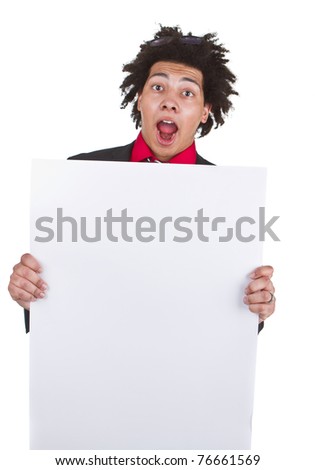 Young afro american man holding a sign that leaves space for advertising.