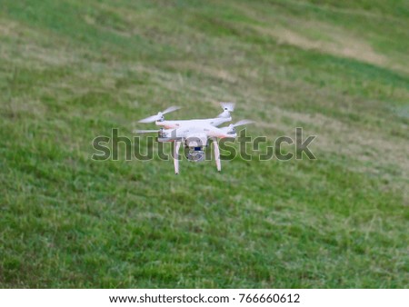 Drone landing on green grass