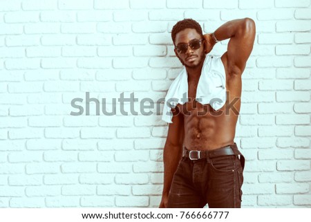 Fashion shot of a smiling attractive fit African American model