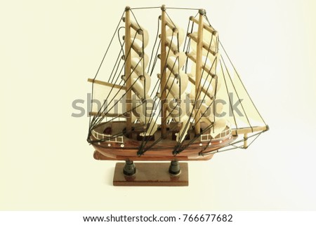 Model sailboat on a white background