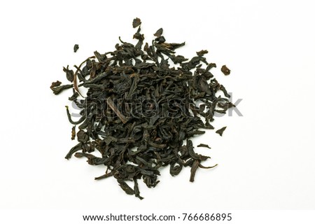 Pile of leaves quality black tea Earl Gray on white background Royalty-Free Stock Photo #766686895