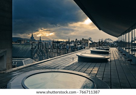 Dramatic cloudy sunset from a rooftop