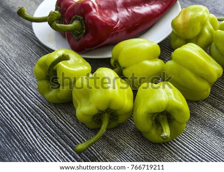 green stuffed pepper and red pepper in the same plate, pepper and cappuccino pictures
