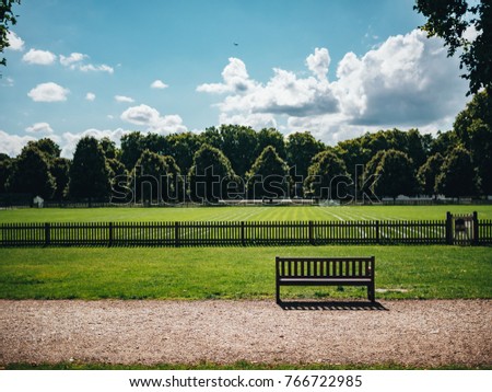 Lonely bench in the park of London.