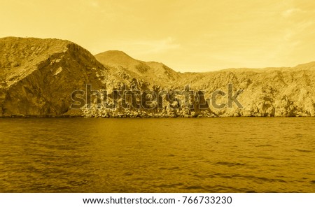 Gold colored Sea of Oman. Middle Ages style photo. Arabian peninsula