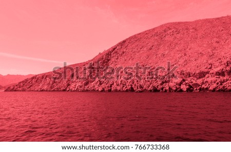 Bloody colored Sea of Oman. Middle Ages style photo. Arabian peninsula