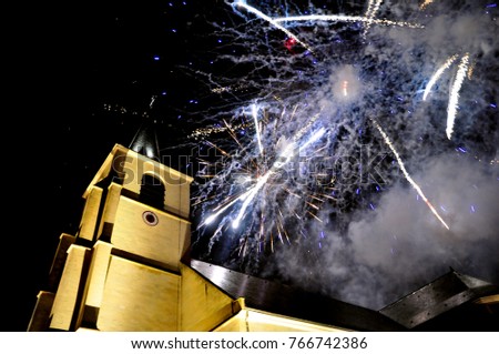Fireworks over a church at Christmas