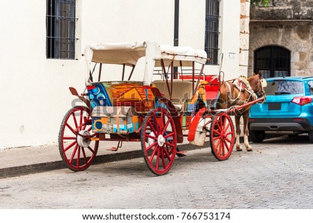 Retro carriage with a horse on a city street in Santo Domingo, Dominican Republic. Copy space for text