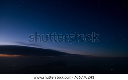 Mountains, sky and stars in the night sky are very beautiful.