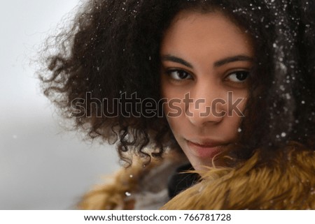 Cheerful attractive afro American female in winter 
